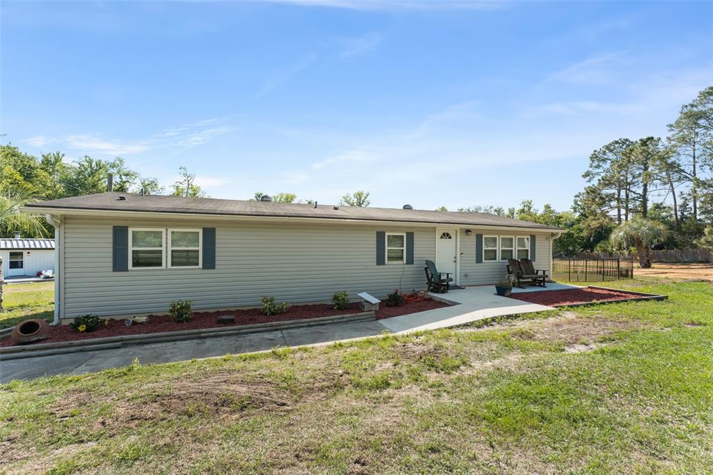 16838 Old Highway 50 East Clermont, FL 34711 - Photo 29 of 51 a view of a house with swimming pool and sitting area