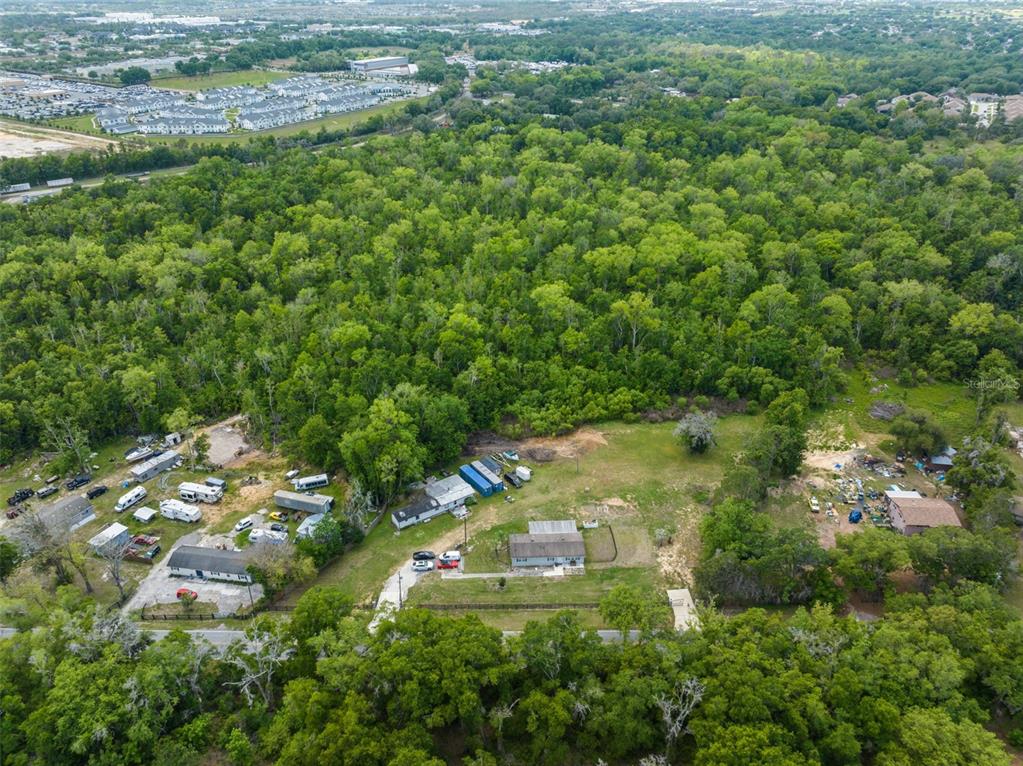 16838 Old Highway 50 East Clermont, FL 34711 - Photo 33 of 51 a view of a town with lush green forest