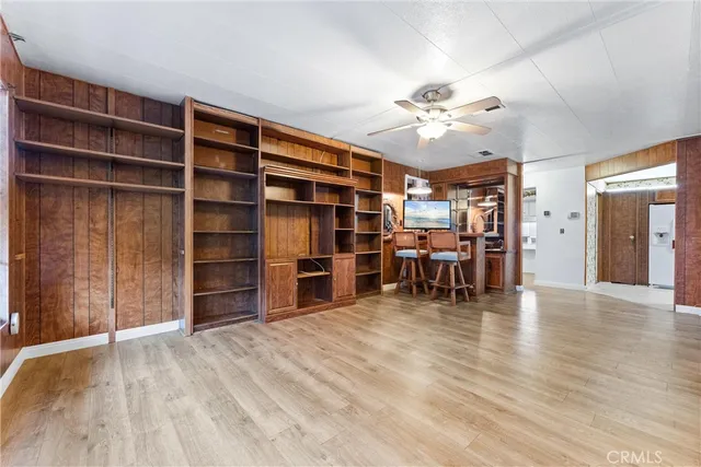 a view of a workspace with furniture and empty room