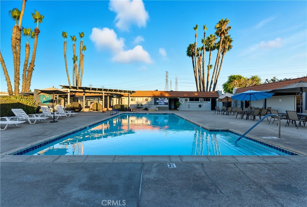 1400 South Sunkist, Unit 80 Anaheim, CA 92806 - Photo 35 of 48 an outdoor space with swimming pool and furniture