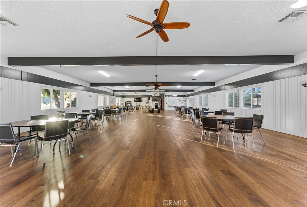 1400 South Sunkist, Unit 80 Anaheim, CA 92806 - Photo 40 of 48 a view of a dining room with furniture and wooden floor
