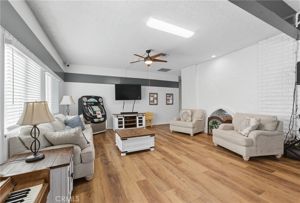 1400 South Sunkist, Unit 80 Anaheim, CA 92806 - Photo 42 of 48 a living room with furniture or couch and a flat screen tv