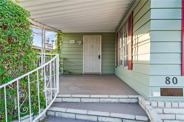 a view of a door and wooden floor