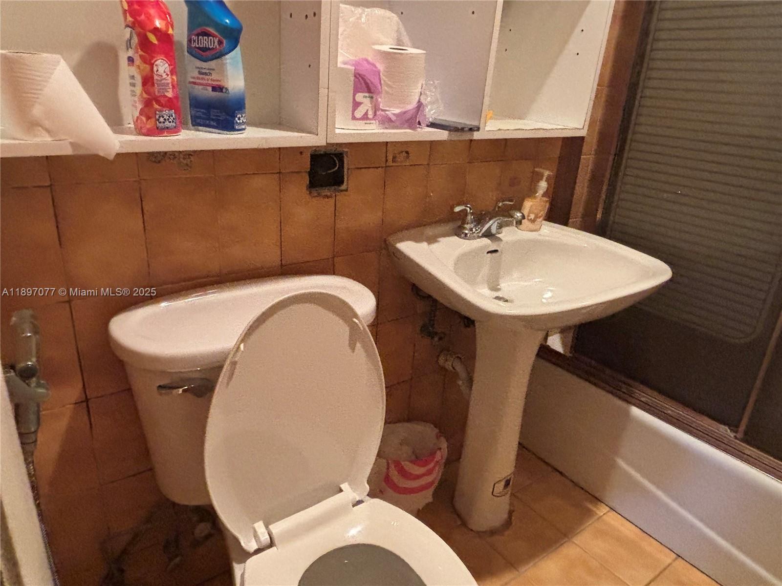 6261 Southwest 6th Street Miami, FL 33144 - Photo 13 of 29 a bathroom with a toilet and a sink