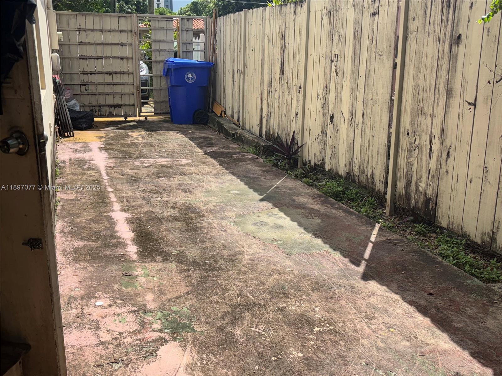 6261 Southwest 6th Street Miami, FL 33144 - Photo 20 of 29 a view of a backyard with pathway