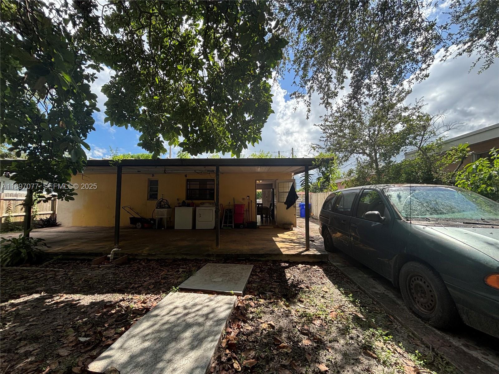 6261 Southwest 6th Street Miami, FL 33144 - Photo 21 of 29 a view of a car park in front of a house