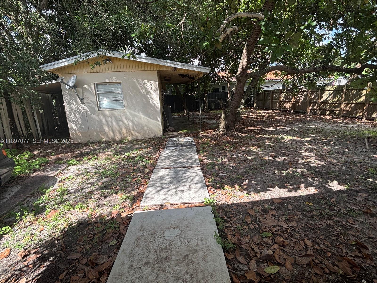 6261 Southwest 6th Street Miami, FL 33144 - Photo 23 of 29 a front view of a house with a yard