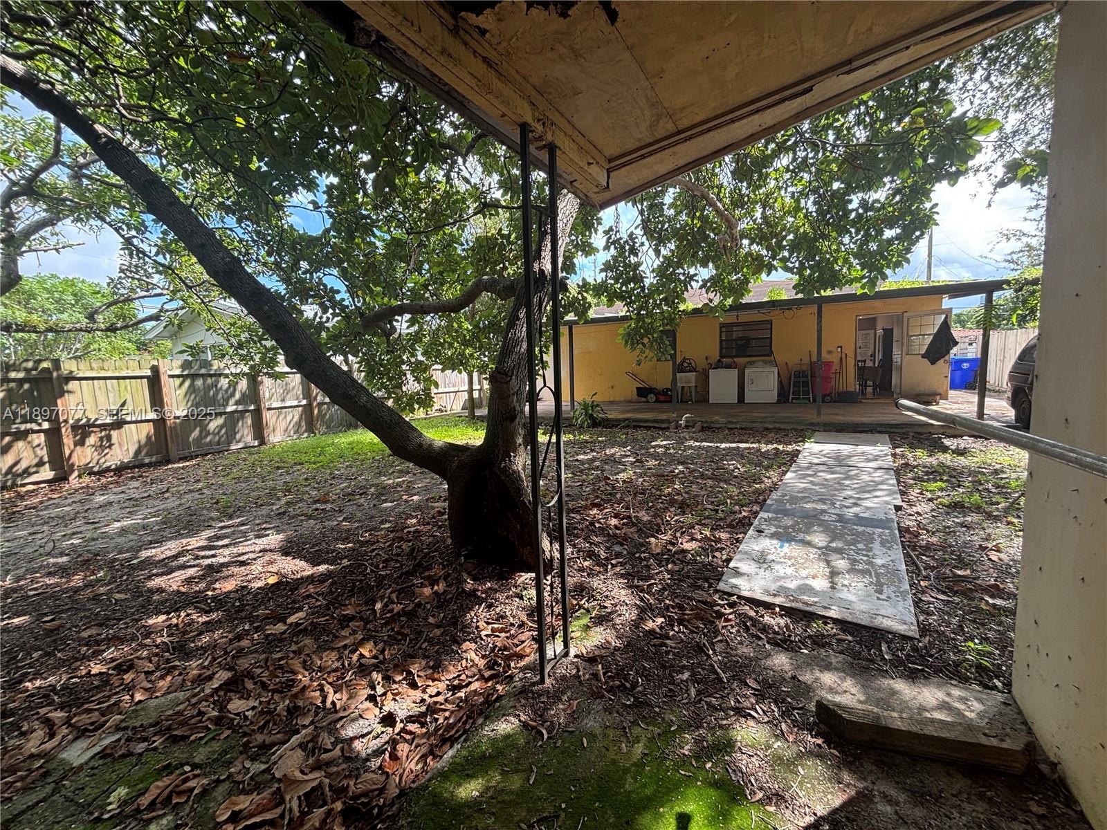 6261 Southwest 6th Street Miami, FL 33144 - Photo 24 of 29 a view of a backyard with large tree