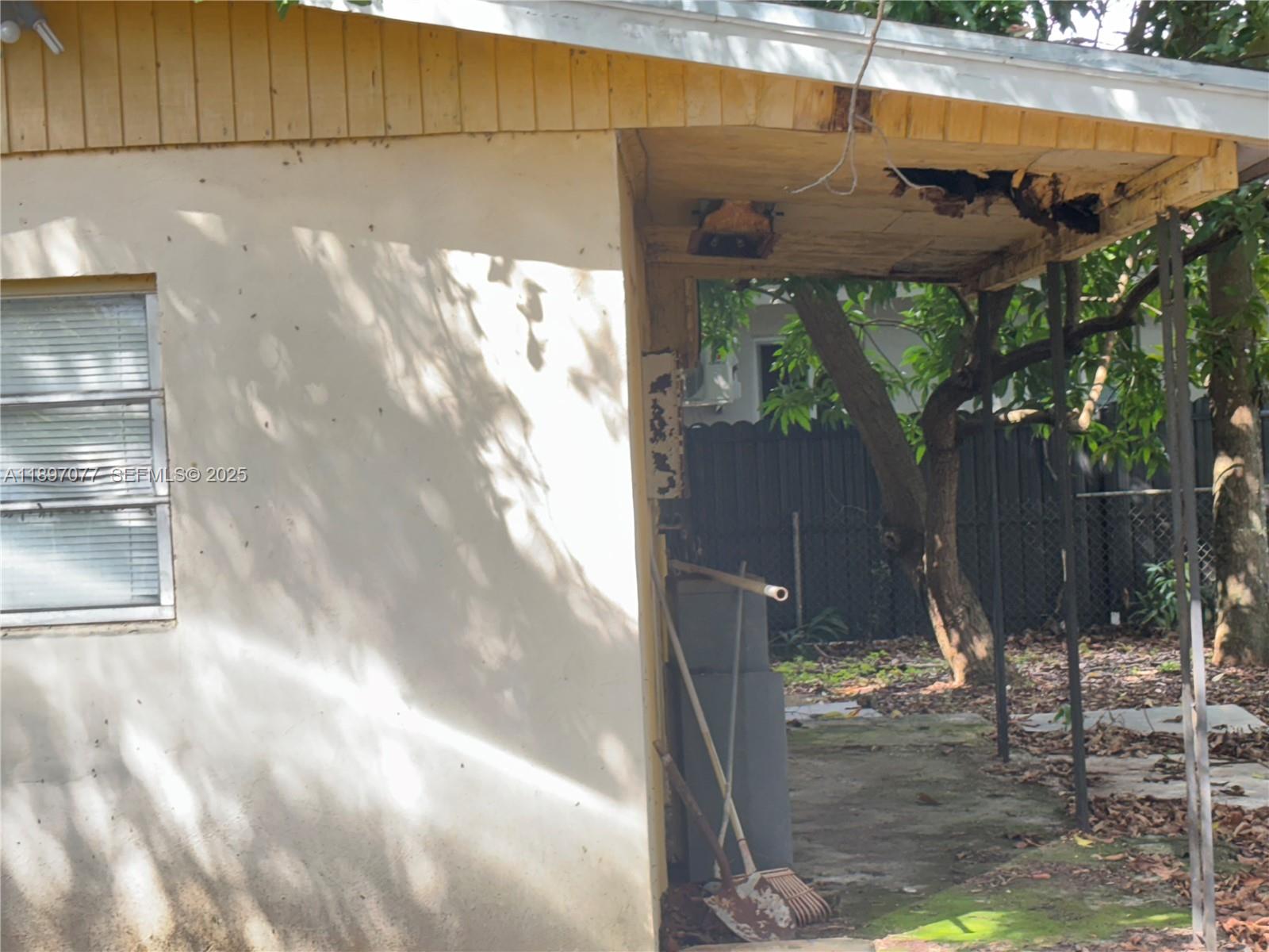 6261 Southwest 6th Street Miami, FL 33144 - Photo 25 of 29 a view of backyard with wooden fence