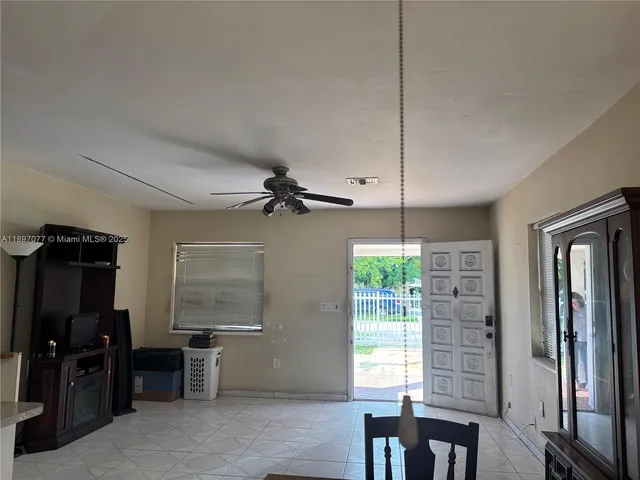 a view of a livingroom with furniture and windows