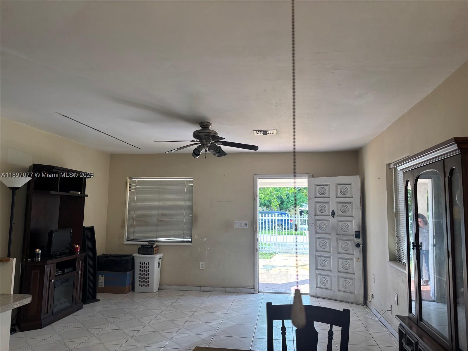 6261 Southwest 6th Street Miami, FL 33144 - Photo 3 of 29 a view of a livingroom with furniture and windows