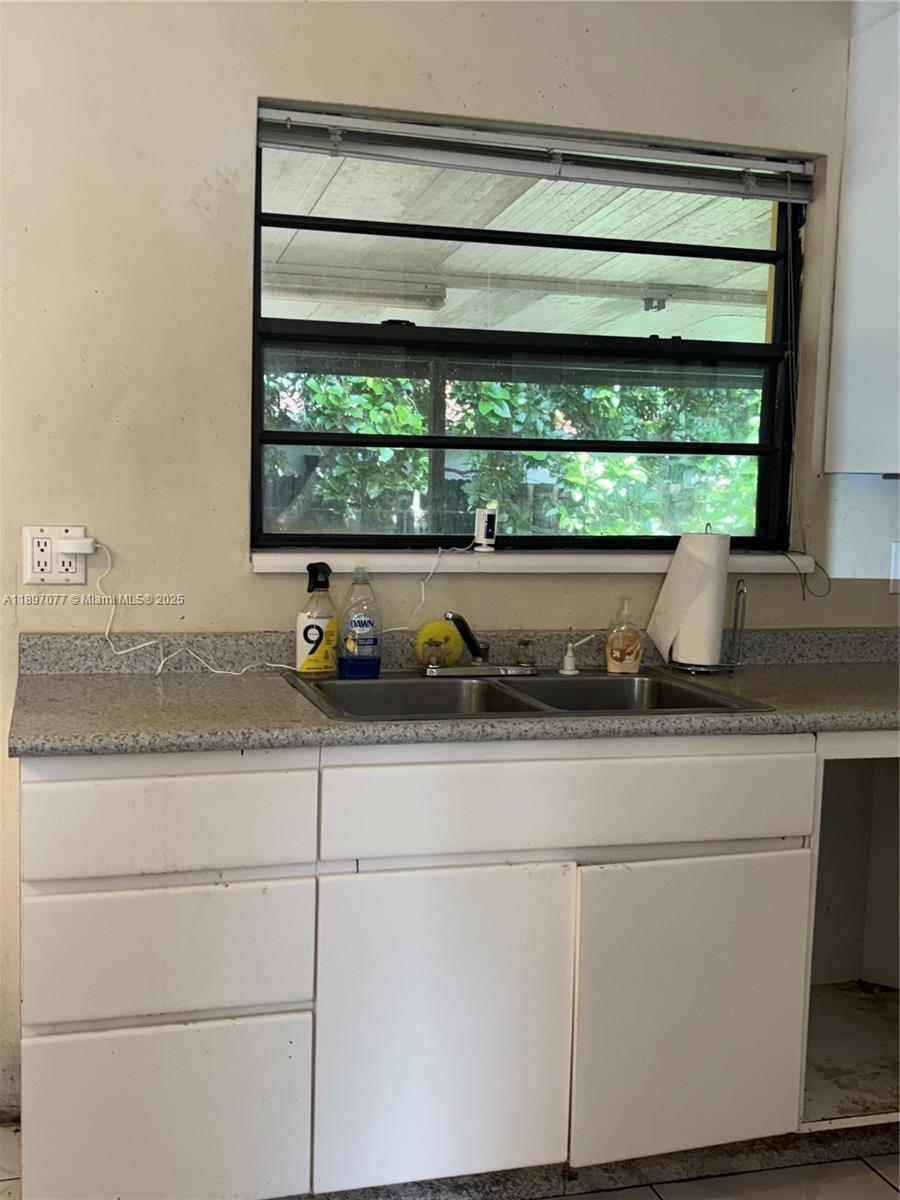 6261 Southwest 6th Street Miami, FL 33144 - Photo 8 of 29 a sink with a outdoor space