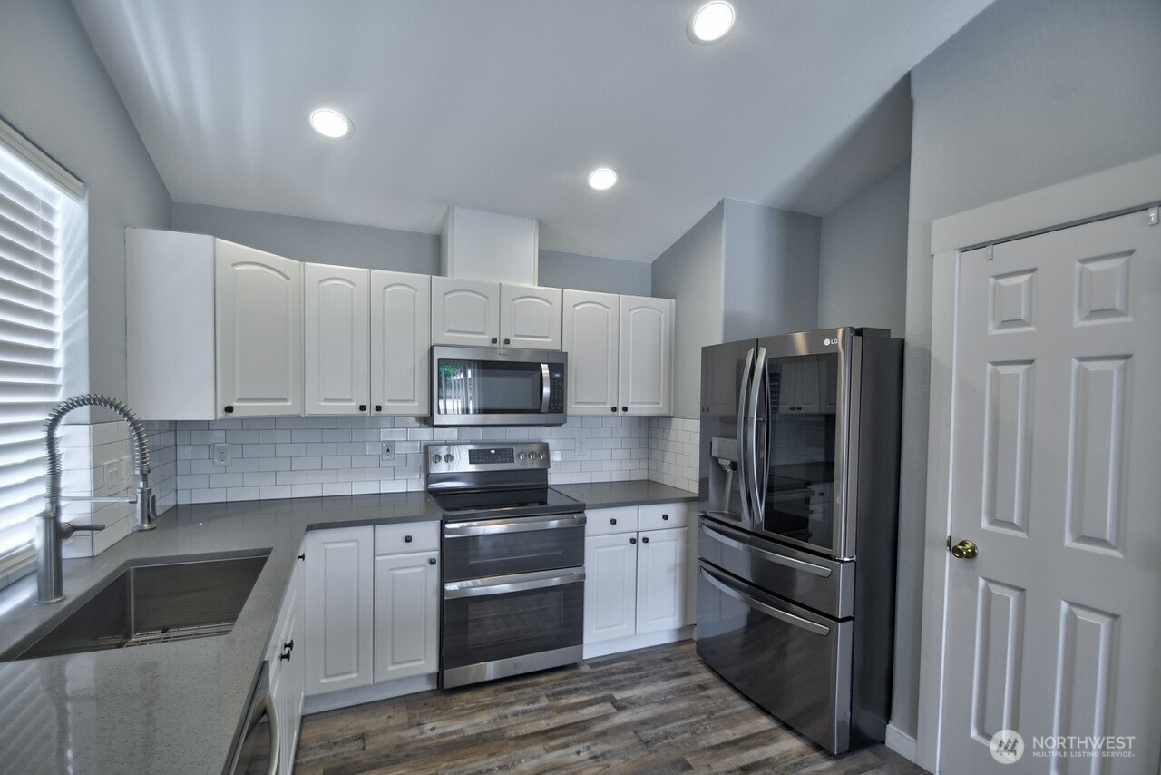 8603 194th Avenue Southwest Rochester, WA 98579 - Photo 11 of 32 a kitchen with stainless steel appliances and refrigerator