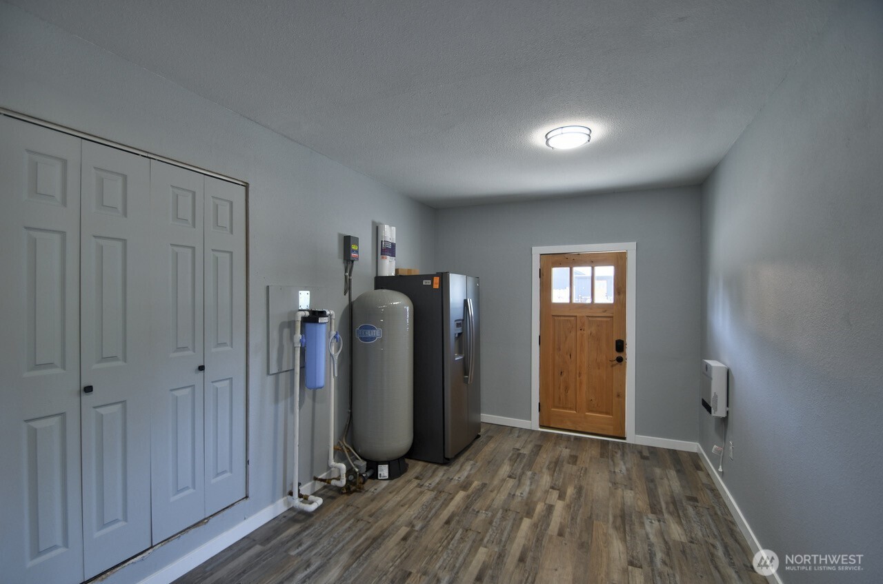 8603 194th Avenue Southwest Rochester, WA 98579 - Photo 15 of 32 a view of a room with wooden floor and closet area