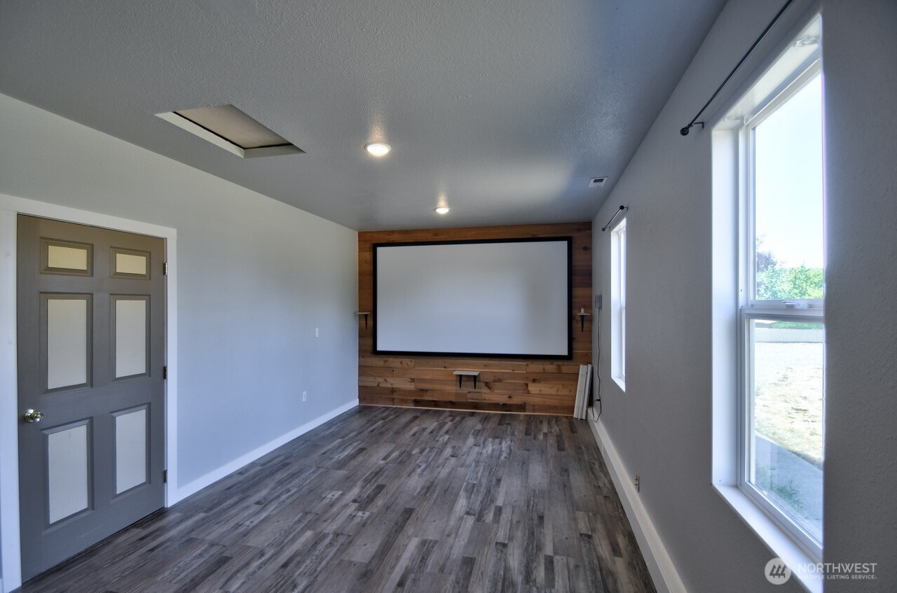 8603 194th Avenue Southwest Rochester, WA 98579 - Photo 17 of 32 a view of room with wooden floor