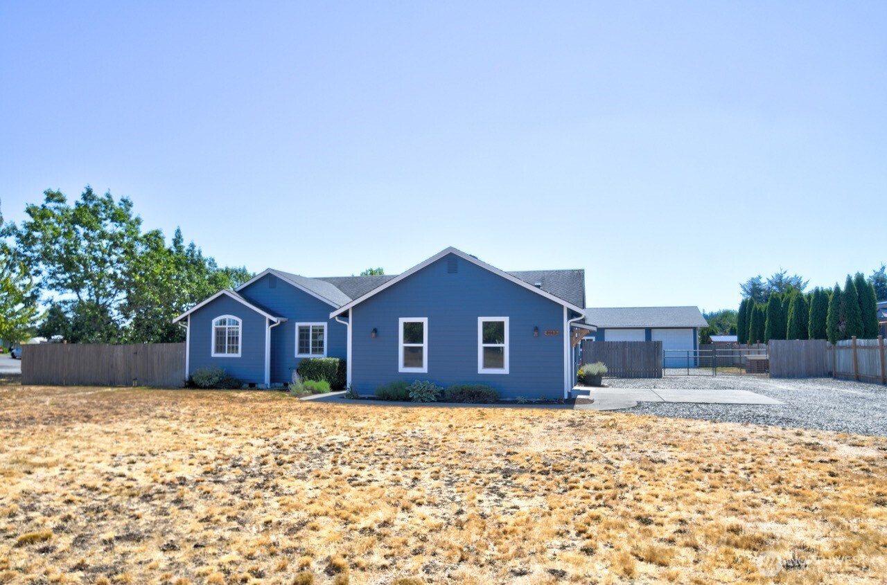 8603 194th Avenue Southwest Rochester, WA 98579 - Photo 2 of 32 a front view of a house with a yard