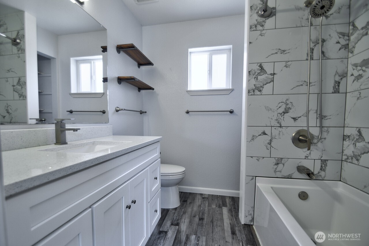 8603 194th Avenue Southwest Rochester, WA 98579 - Photo 21 of 32 a bathroom with a sink a toilet and bathtub