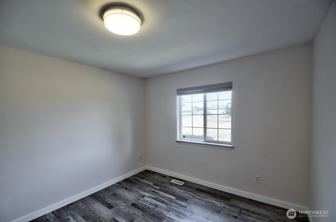 8603 194th Avenue Southwest Rochester, WA 98579 - Photo 25 of 32 an empty room with a window