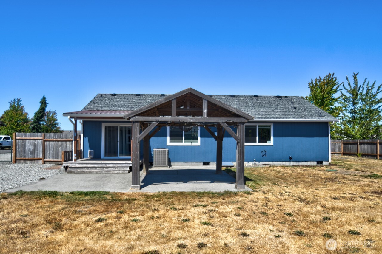 8603 194th Avenue Southwest Rochester, WA 98579 - Photo 28 of 32 a view of a house with backyard and sitting area