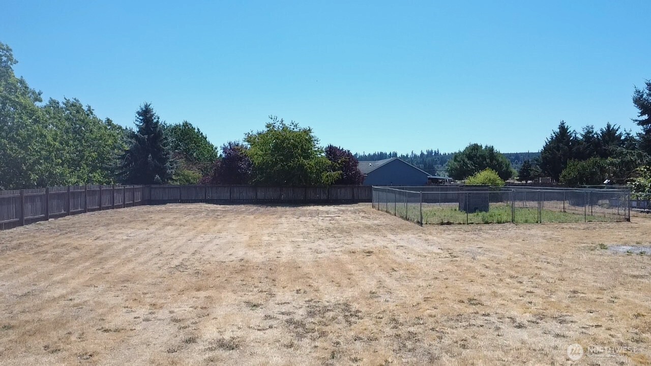8603 194th Avenue Southwest Rochester, WA 98579 - Photo 32 of 32 a view of wooden floor and fence