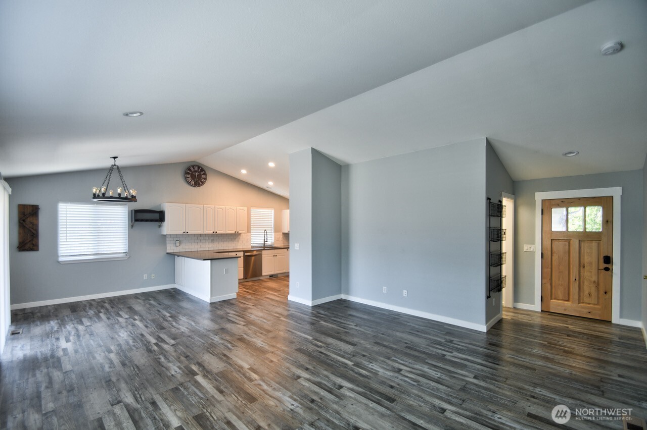 8603 194th Avenue Southwest Rochester, WA 98579 - Photo 4 of 32 a view of kitchen with wooden floor and window