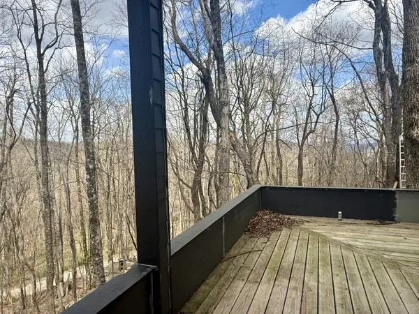 a view of a backyard from a balcony