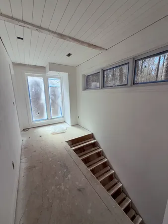 an empty room with windows