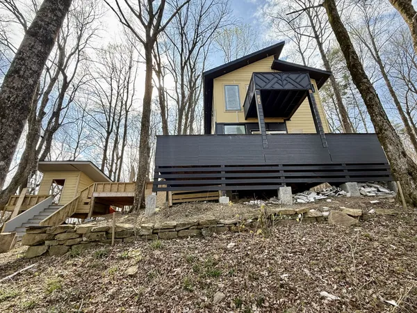 a side view of a house with a yard