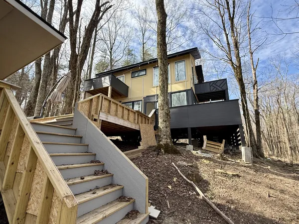 a view of a house with wooden stairs