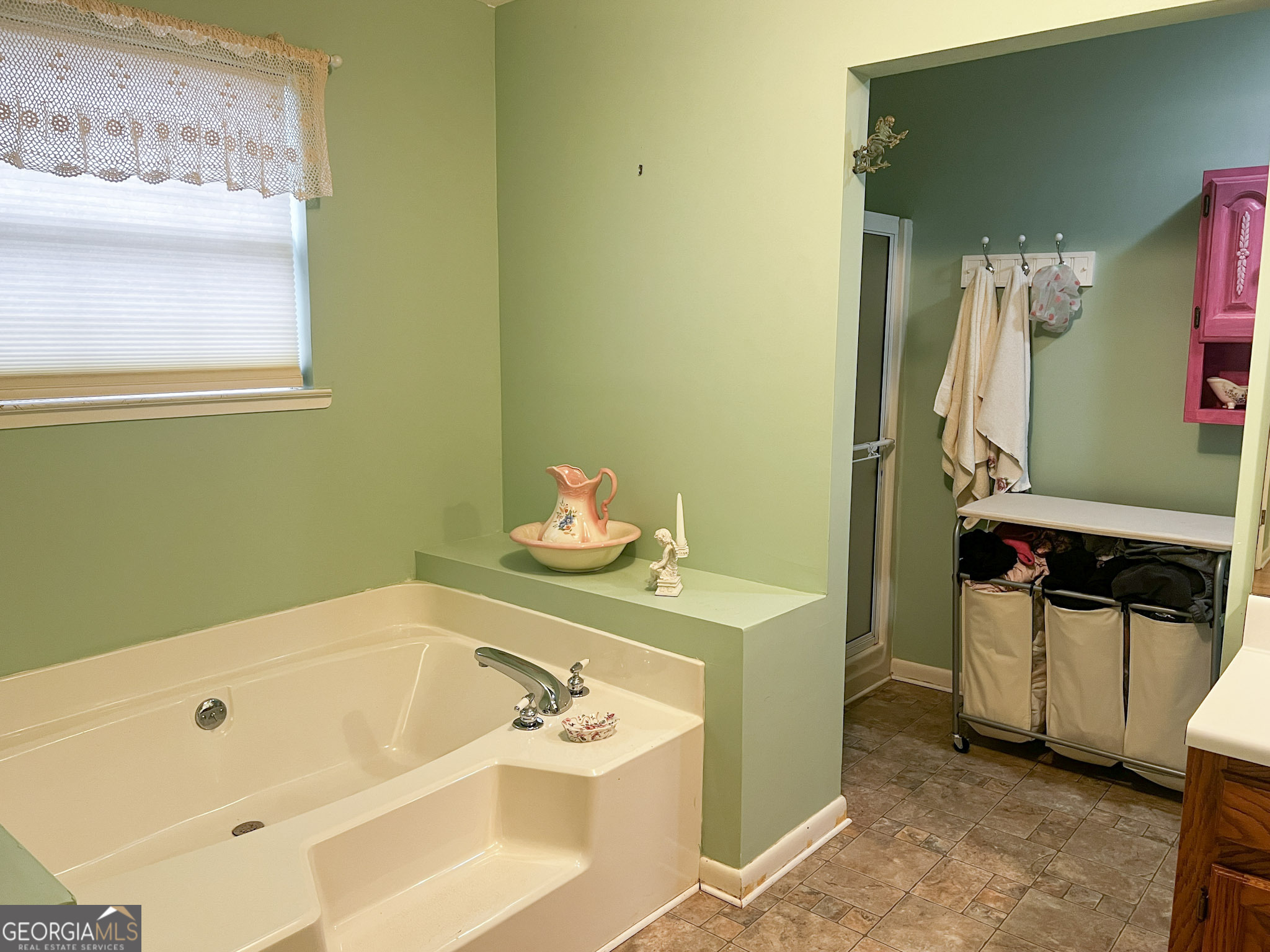 153 View Street Clarkesville, GA 30523 - Photo 16 of 31 a bath tub sitting next to a bathroom sink