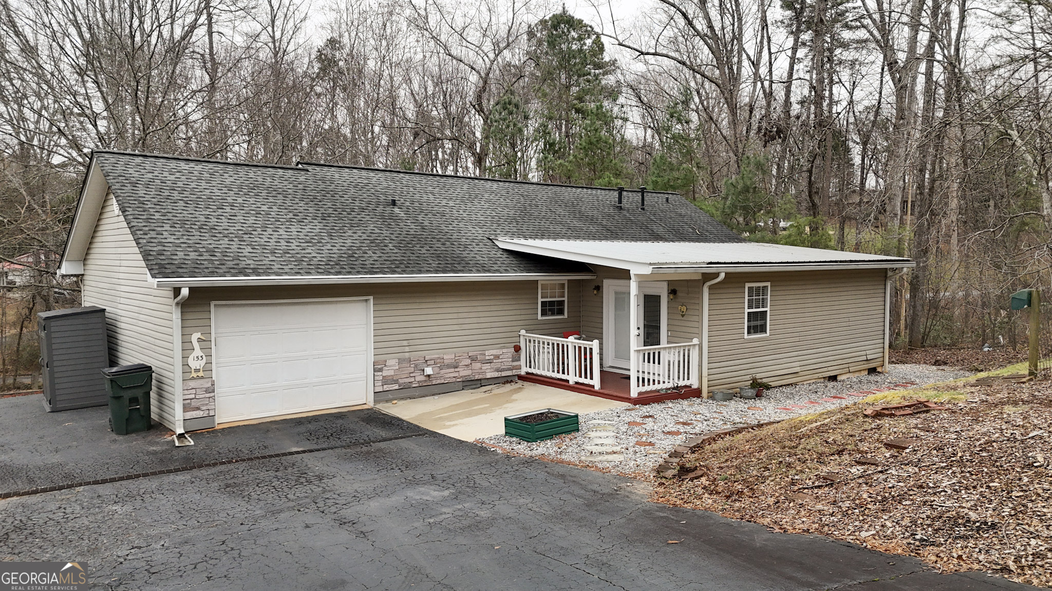 153 View Street Clarkesville, GA 30523 - Photo 2 of 31 a view of a house with a patio and wooden fence