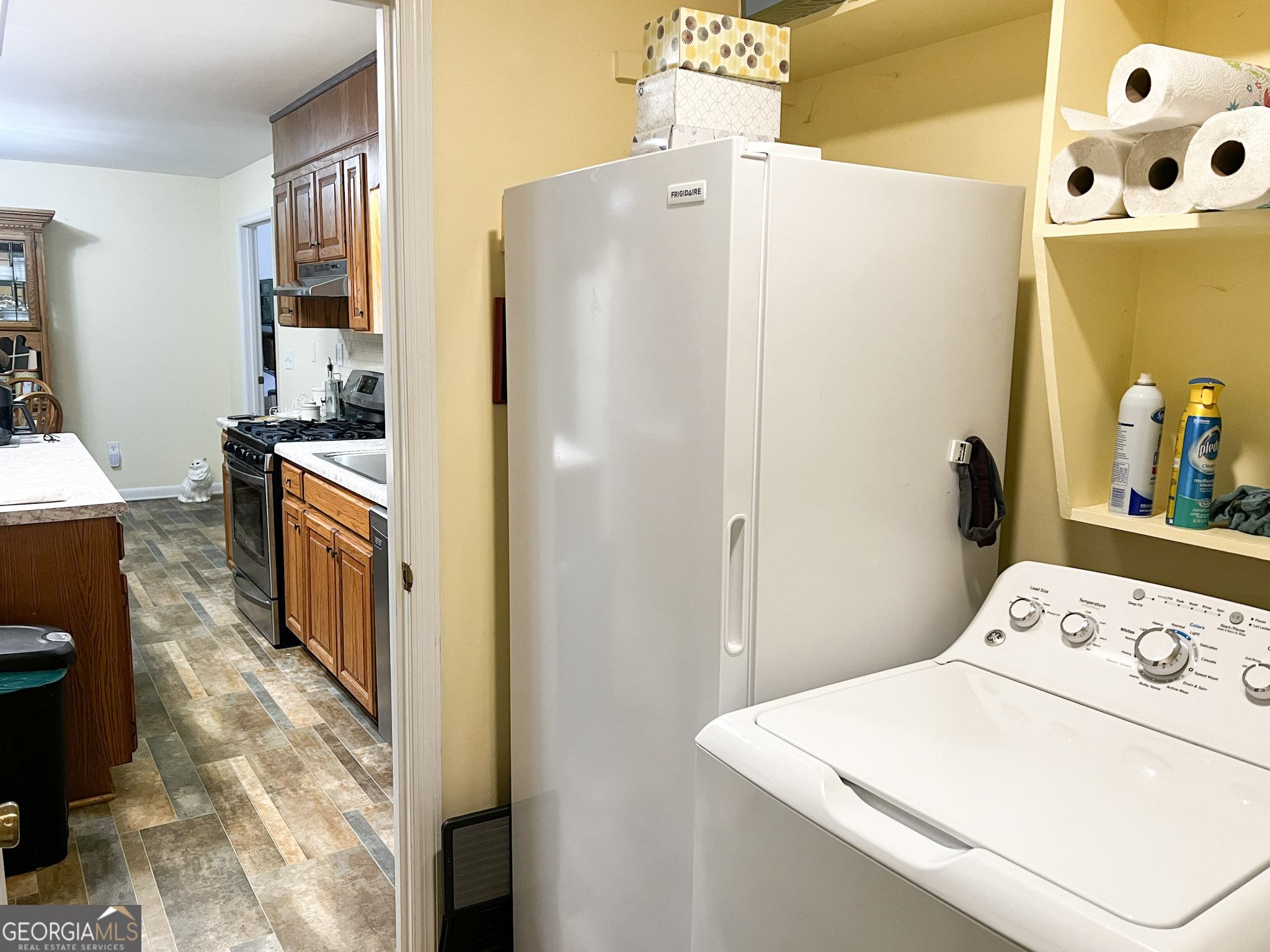 153 View Street Clarkesville, GA 30523 - Photo 24 of 31 a kitchen with stainless steel appliances a refrigerator a stove a washer and dryer
