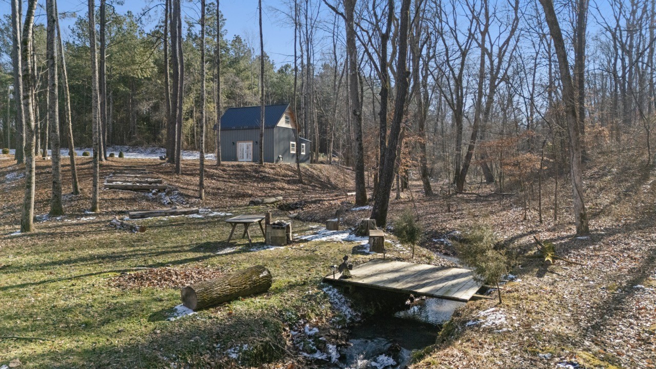 1085 Henegar Road Morrison, TN 37357 - Photo 17 of 17 a view of a house with backyard and trees