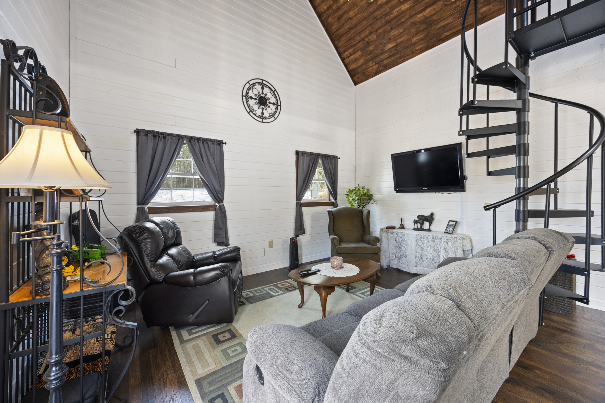 1085 Henegar Road Morrison, TN 37357 - Photo 2 of 17 a living room with furniture a flat screen tv and a large window
