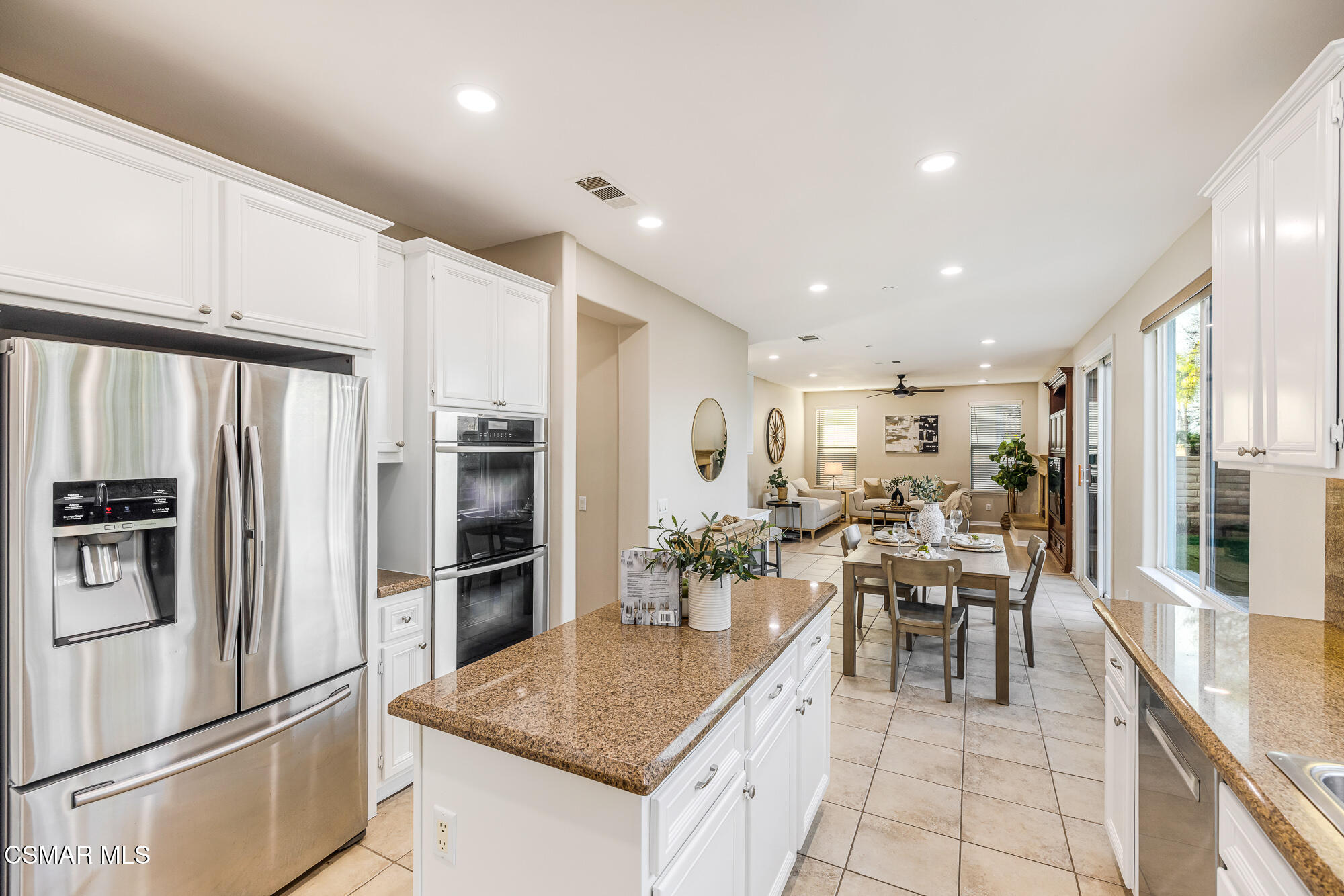 5353 Willow Oak Street Simi Valley, CA 93063 - Photo 13 of 52 a kitchen with stainless steel appliances granite countertop a refrigerator and a stove top oven