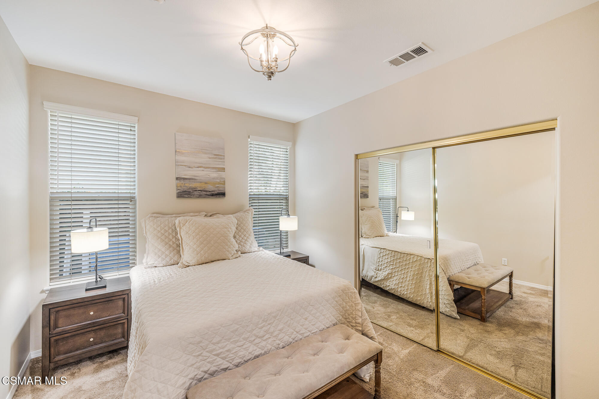 5353 Willow Oak Street Simi Valley, CA 93063 - Photo 16 of 52 a bedroom with a bed and a chandelier