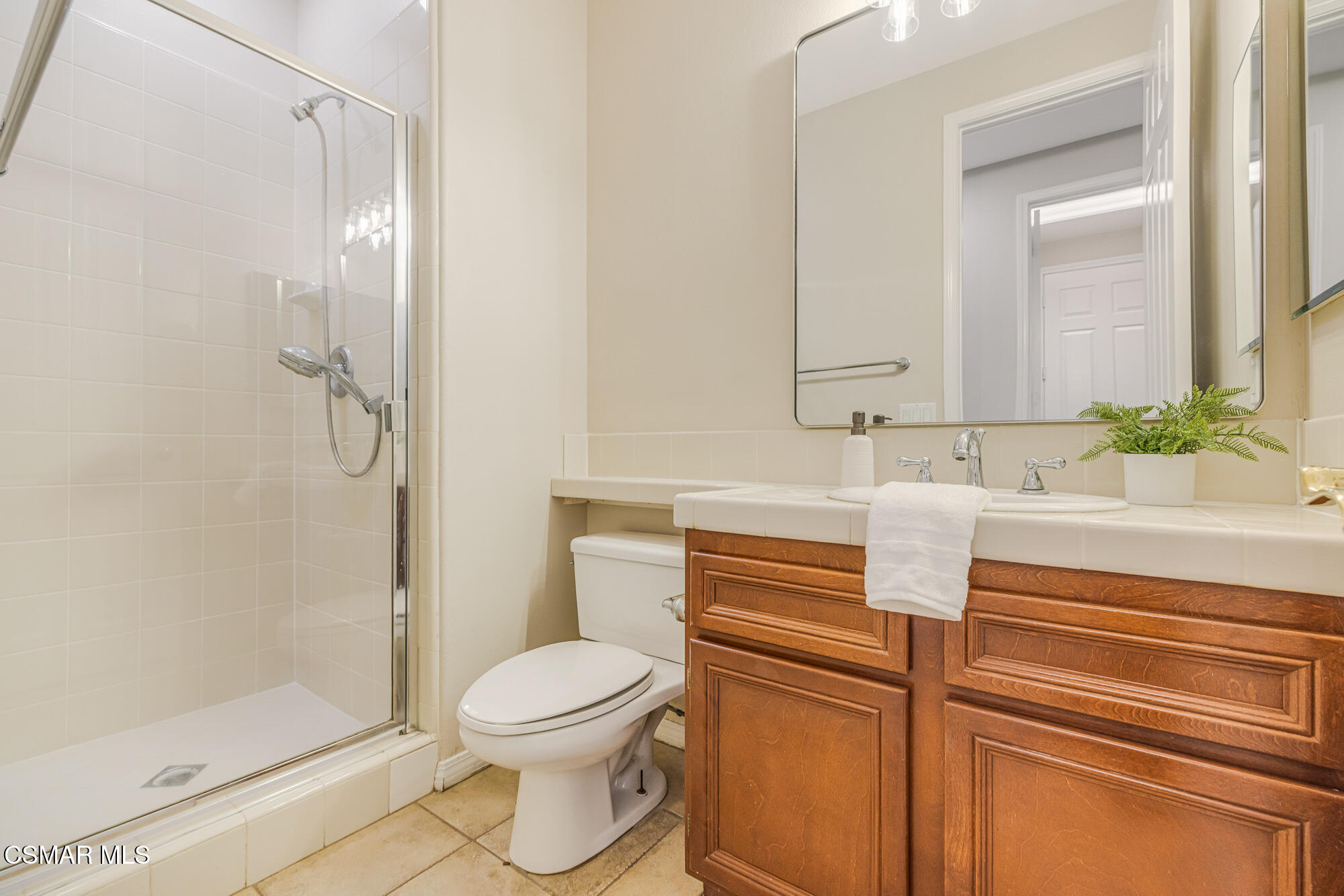 5353 Willow Oak Street Simi Valley, CA 93063 - Photo 19 of 52 a bathroom with a sink a toilet and shower