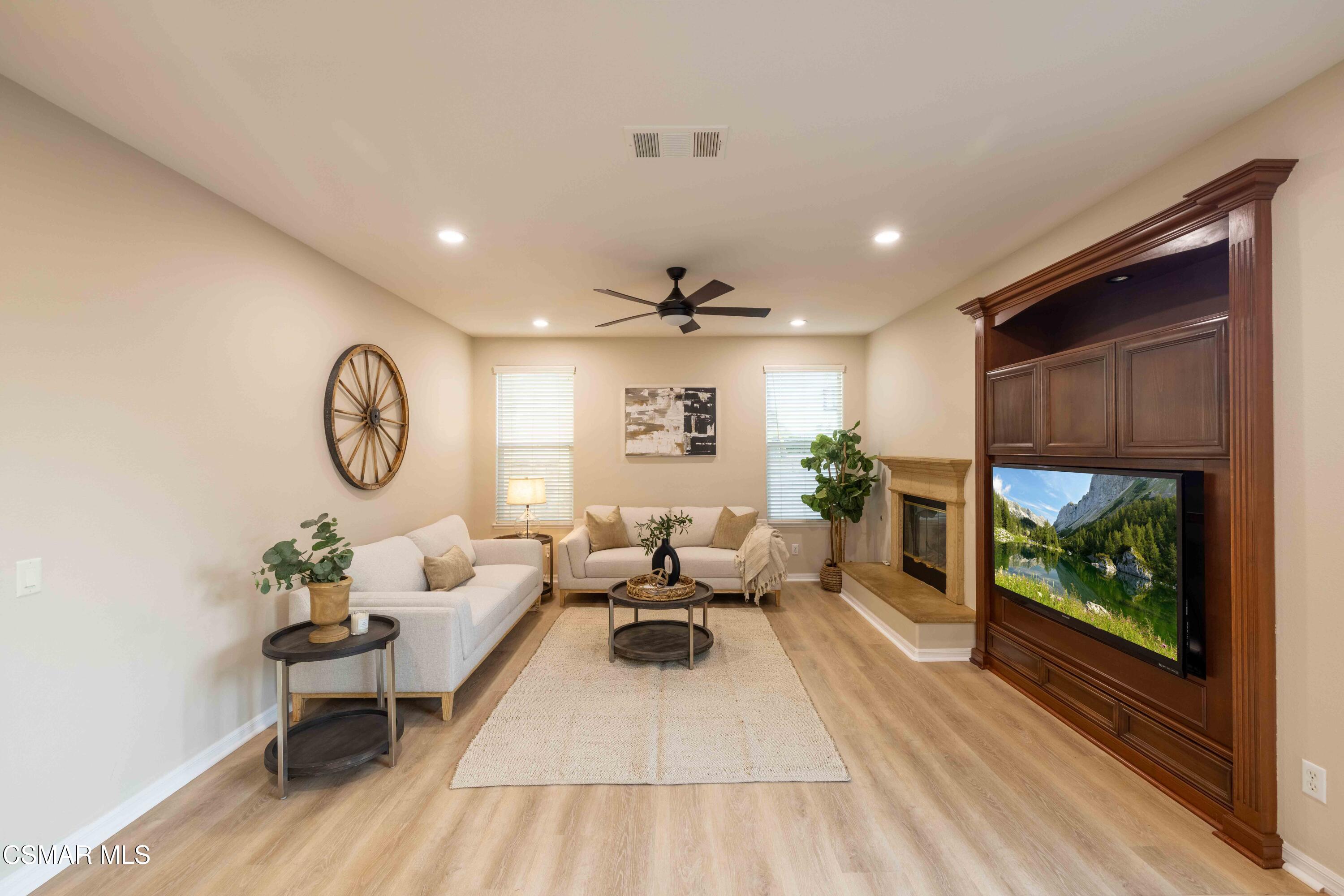 5353 Willow Oak Street Simi Valley, CA 93063 - Photo 25 of 52 a living room with furniture a window and a flat screen tv