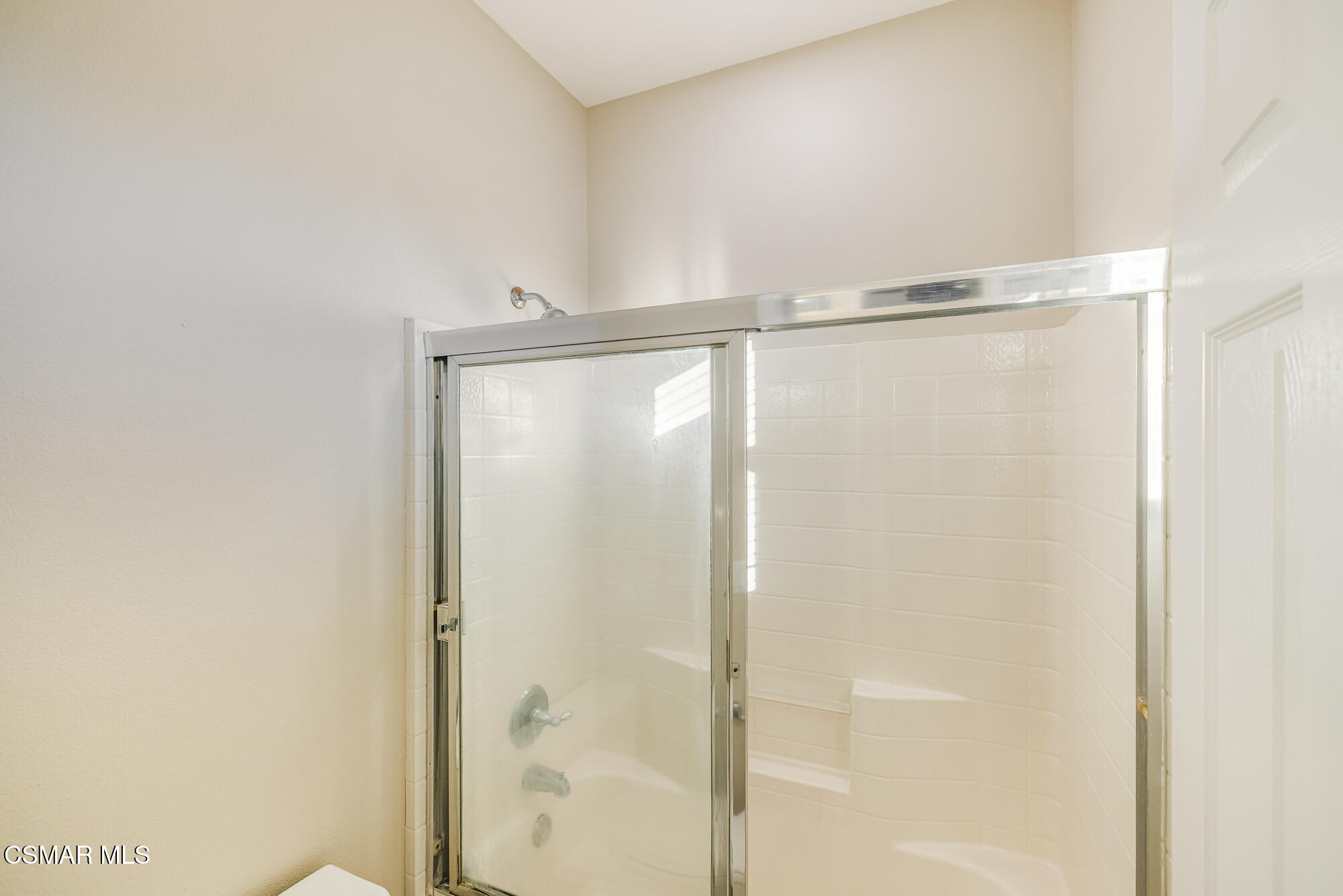 5353 Willow Oak Street Simi Valley, CA 93063 - Photo 29 of 52 a bathroom with a glass shower door