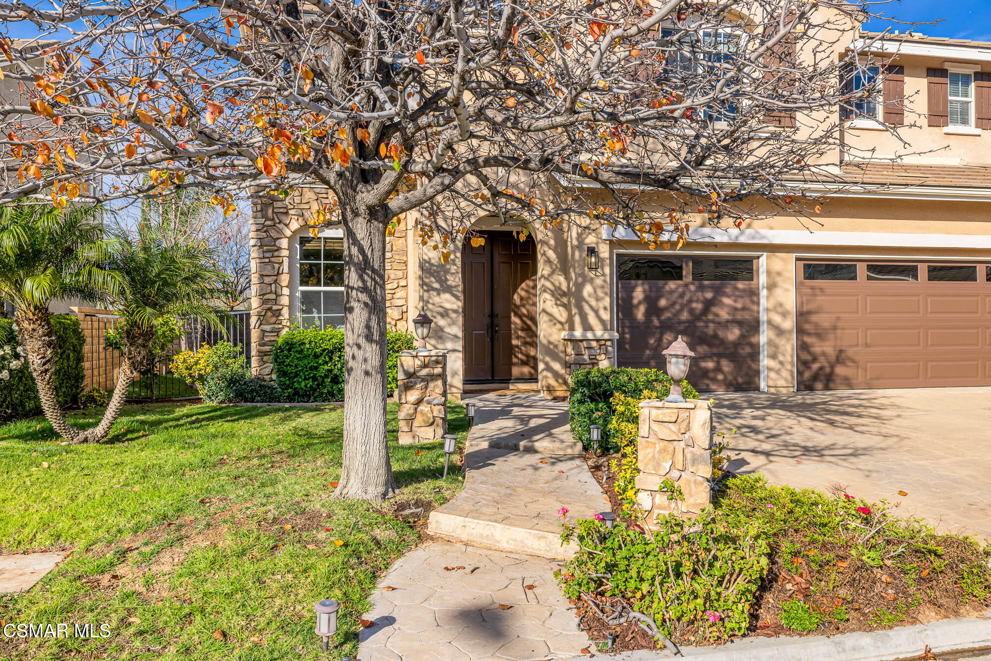 5353 Willow Oak Street Simi Valley, CA 93063 - Photo 3 of 52 a front view of a house with garden