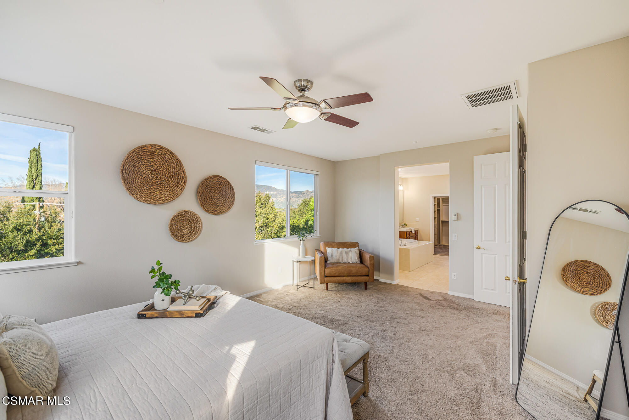 5353 Willow Oak Street Simi Valley, CA 93063 - Photo 35 of 52 a bedroom with a bed and a chandelier