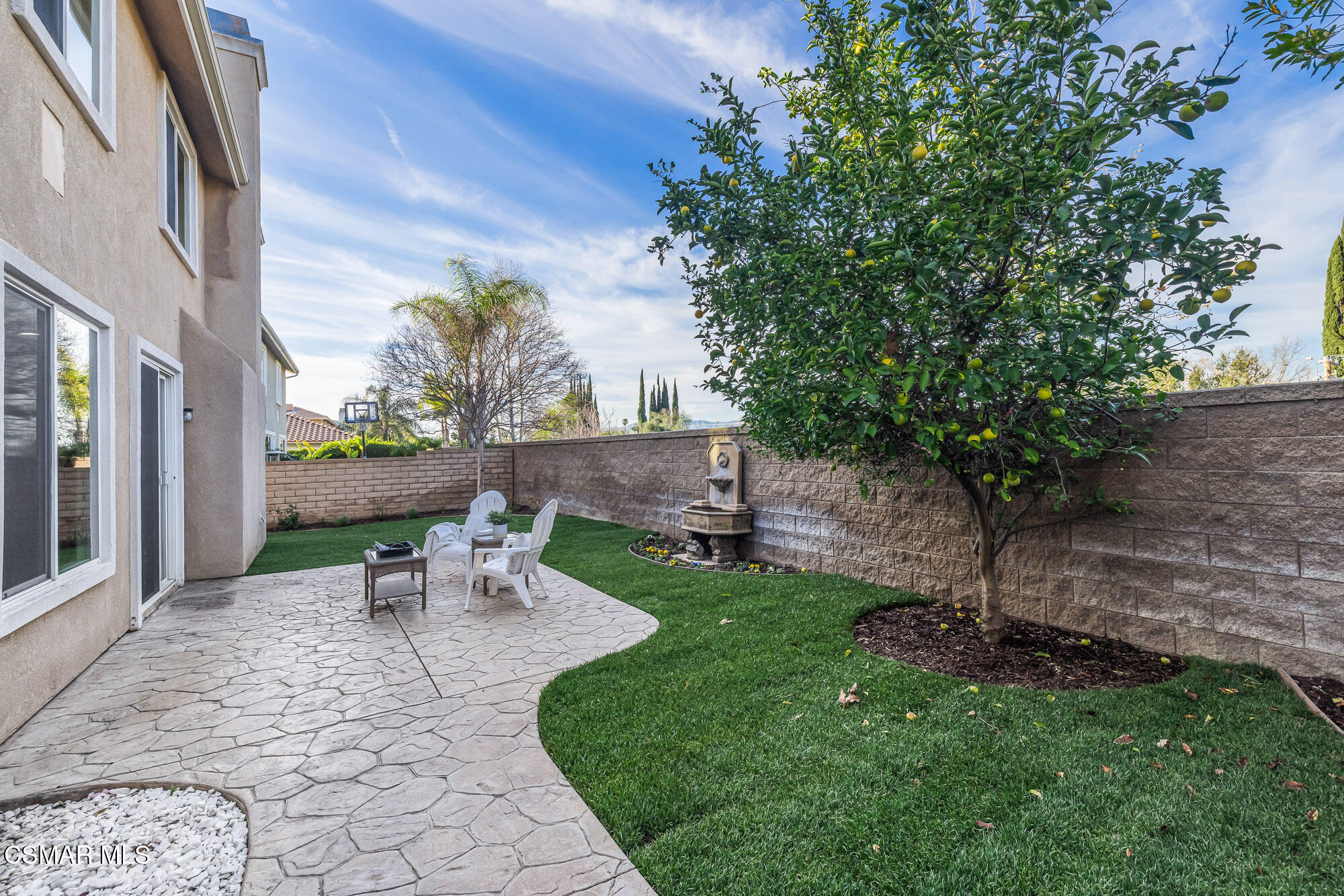5353 Willow Oak Street Simi Valley, CA 93063 - Photo 41 of 52 a view of a patio with table and chairs potted plants and large tree