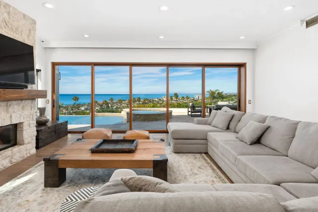 a living room with fireplace furniture and a flat screen tv