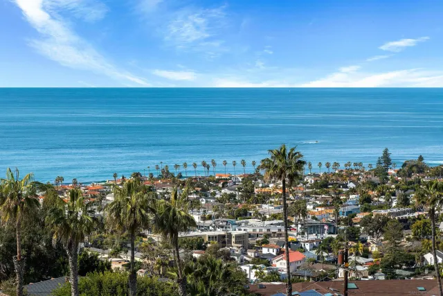 a bedroom with bed and wooden floor