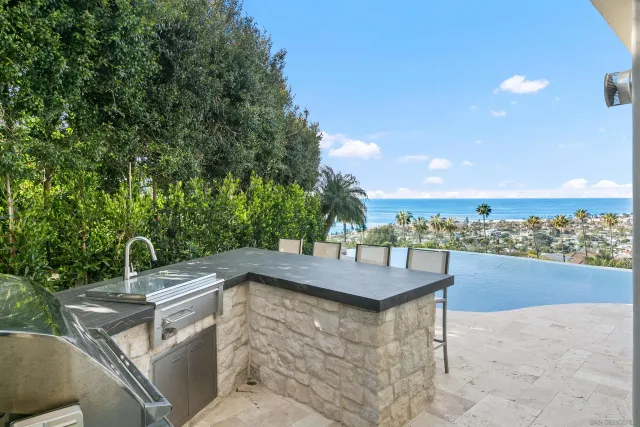 a view of a patio with a table and chairs