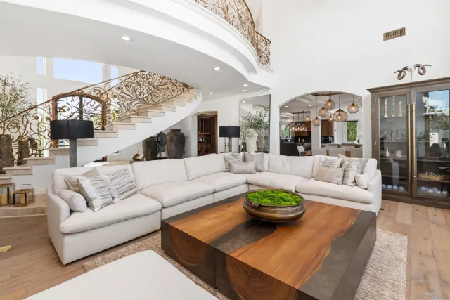 a view of a dining room with furniture and chandelier