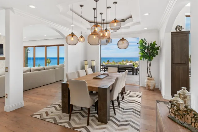 a large kitchen with a table and chairs
