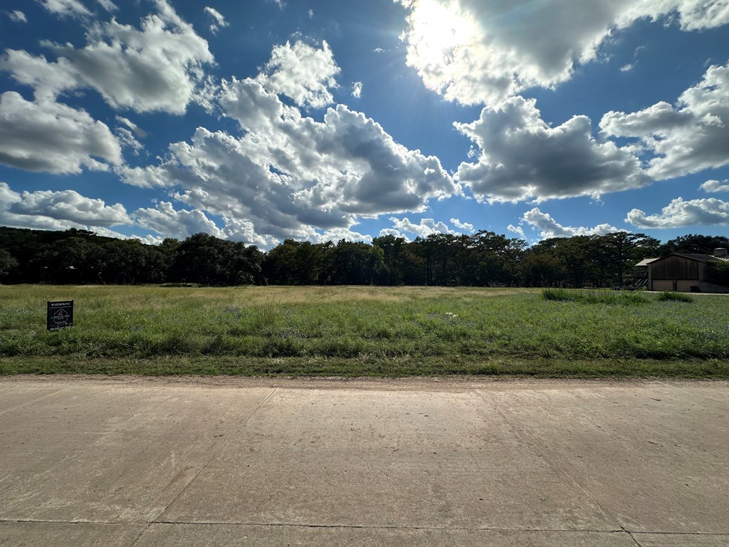 129 Russo Lane, Unit 3 Hunt, TX 78024 - Photo 3 of 16 a view of a golf course with a lake