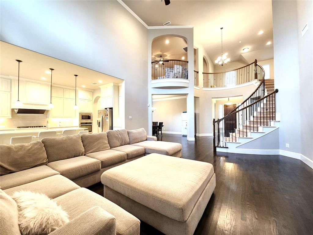 7163 Split Rein Road Frisco, TX 75036 - Photo 18 of 40 a living room with furniture and a large window