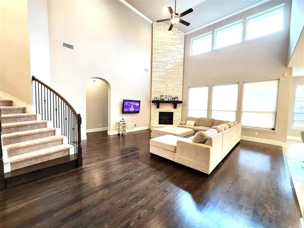 a view of living room with furniture and windows